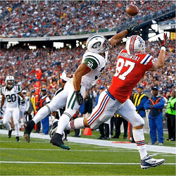 NFL Players catching ball
